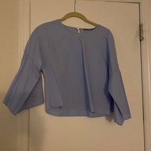 Blue shirt frilled sleeves